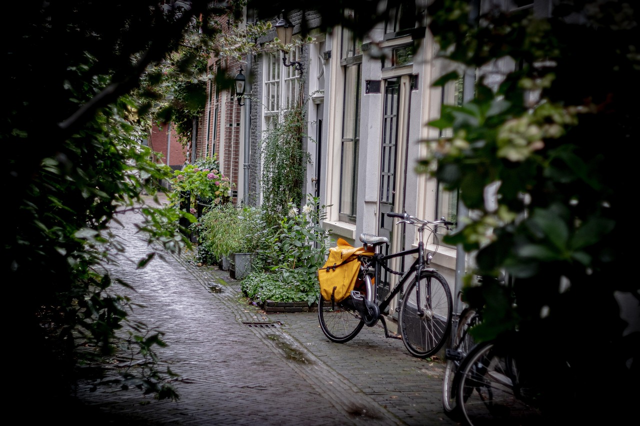 A row of bicycles parked along a colorful street in Copenhagen.