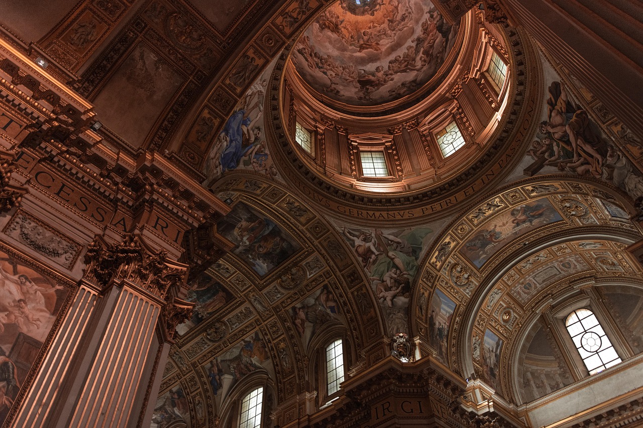 A room in an Italian palazzo with ornate ceiling frescoes and high windows.